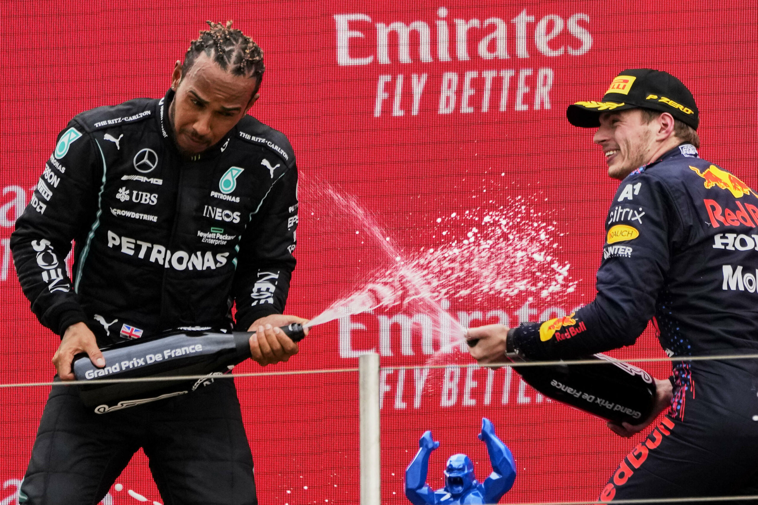 Le Castellet : Red Bull driver Max Verstappen of the Netherlands, right, celebrates from the podium after winning with second place Mercedes driver Lewis Hamilton of Britain from the podium during the French Formula One Grand Prix at the Paul Ricard racetrack in Le Castellet, southern France, Sunday, June 20, 2021. AP/PTI(AP06_20_2021_000212B)